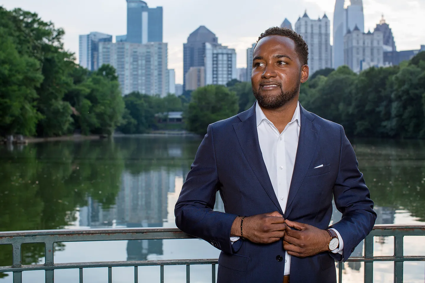Headshot in Piedmont Park with the Atlanta skyline behind